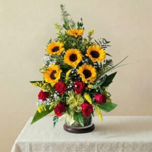 arreglo de girasoles y rosas encima de una mesa